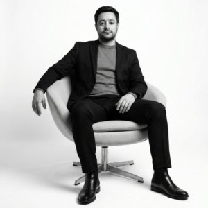 confident man seated in a modern swivel chair